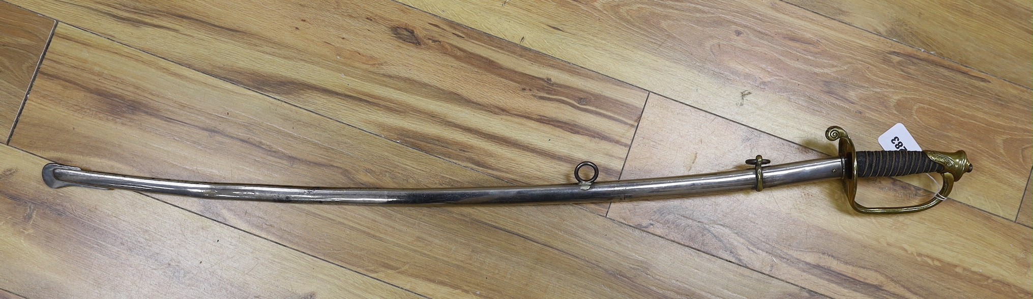 A United States Marines dress sword made by Wilkinson, the blade etched ‘S/SGT. JAMES P.S. DEVEREUX II. 1340836 U.S.M.C.’ with scabbard. Total length 107cm